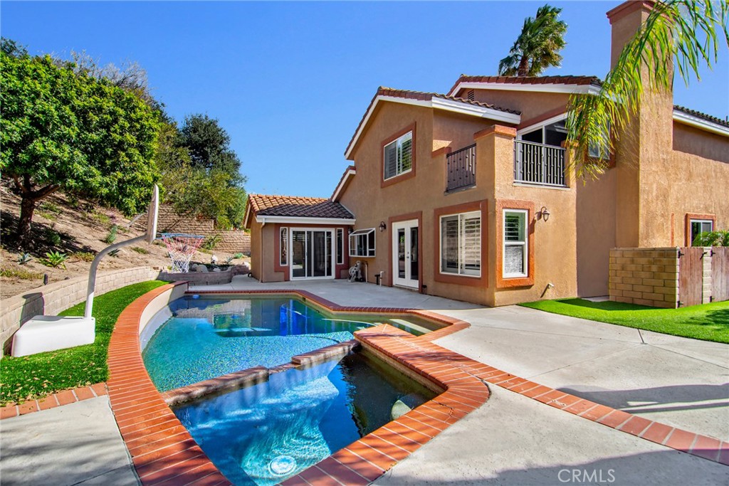 951 Firestone Circle Simi Valley, CA 93065 - Photo 34 of 41 a view of a house with swimming pool and sitting area