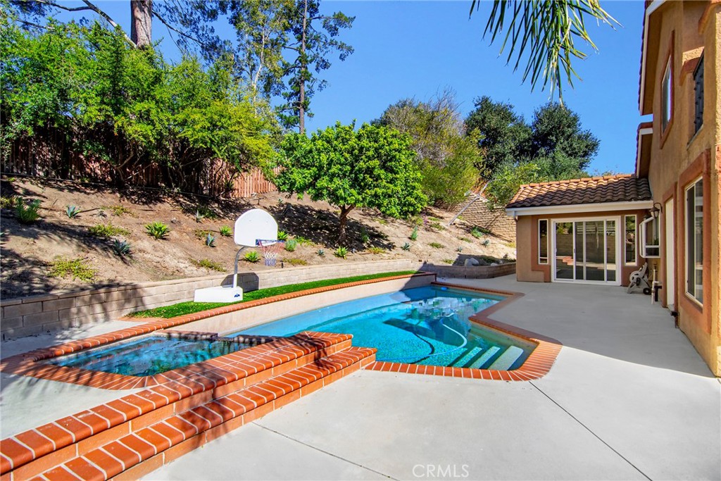 951 Firestone Circle Simi Valley, CA 93065 - Photo 38 of 41 a view of swimming pool with lounge chair and palm trees
