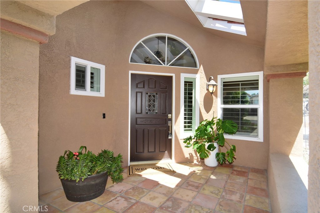 951 Firestone Circle Simi Valley, CA 93065 - Photo 4 of 41 a front view of a house with garden