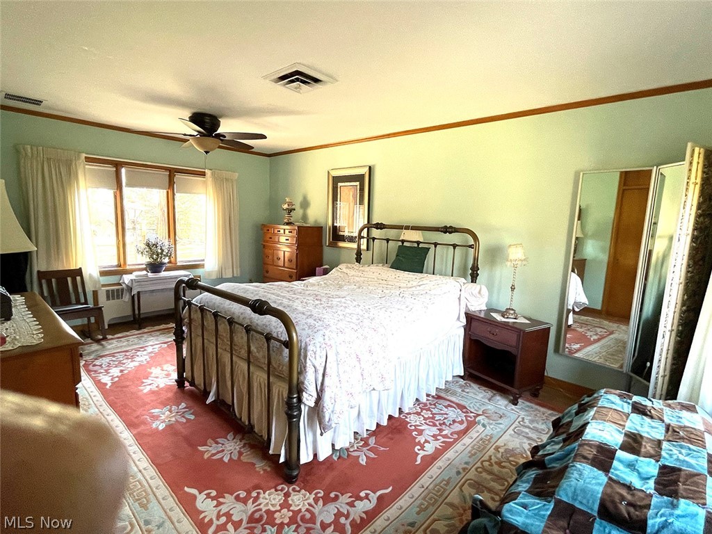 526 Ridgeleigh Street Minerva, OH 44657 - Photo 23 of 28 Bedroom with ornamental molding and ceiling fan