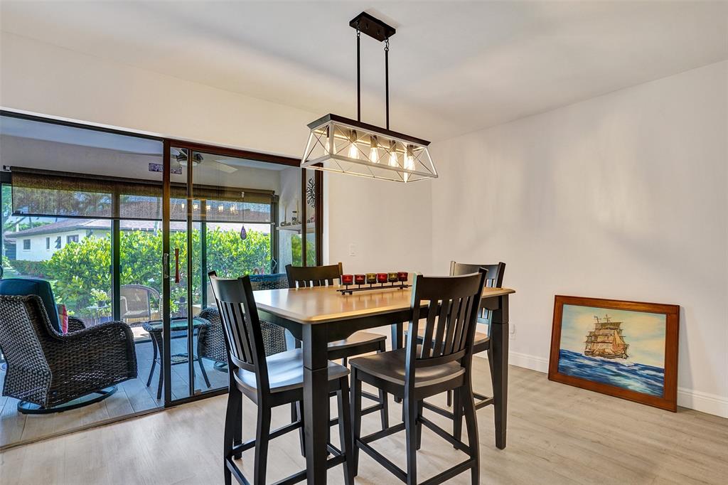 4840 Greentree Lane, Unit B Boynton Beach, FL 33436 - Photo 13 of 68 a view of a dining room with furniture window and outside view