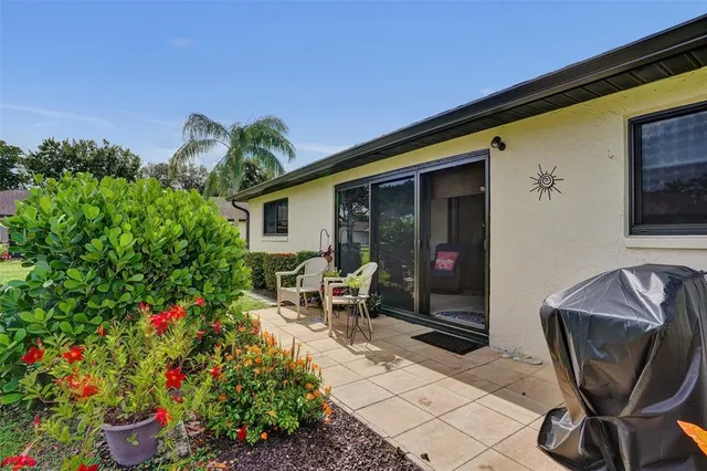 a view of a hallway with wooden floor and closet