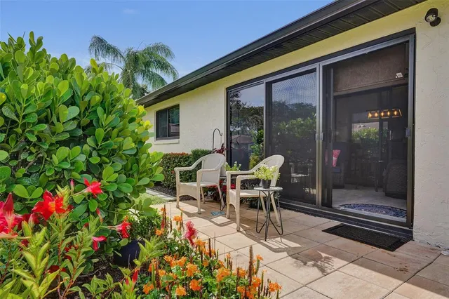 a view of a hallway with wooden floor and closet