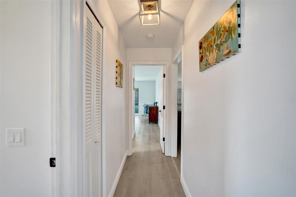 4840 Greentree Lane, Unit B Boynton Beach, FL 33436 - Photo 35 of 68 a view of a hallway with wooden floor and closet