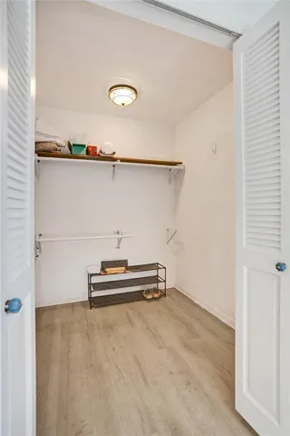 a living room with lots of furniture and a large window