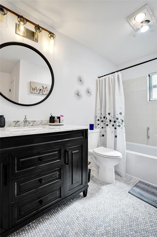 4840 Greentree Lane, Unit B Boynton Beach, FL 33436 - Photo 51 of 68 a bathroom with a sink a toilet and a mirror