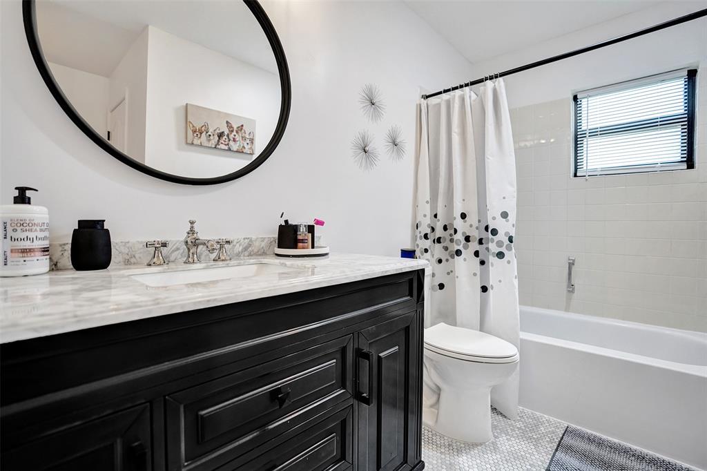 4840 Greentree Lane, Unit B Boynton Beach, FL 33436 - Photo 52 of 68 a bathroom with a sink a toilet and a mirror