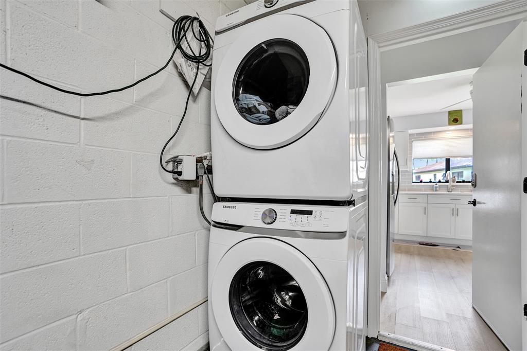 4840 Greentree Lane, Unit B Boynton Beach, FL 33436 - Photo 54 of 68 a view of a storage & utility room with dryer and washer