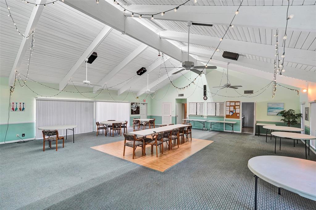 4840 Greentree Lane, Unit B Boynton Beach, FL 33436 - Photo 62 of 68 a living room with lots of furniture and a large window