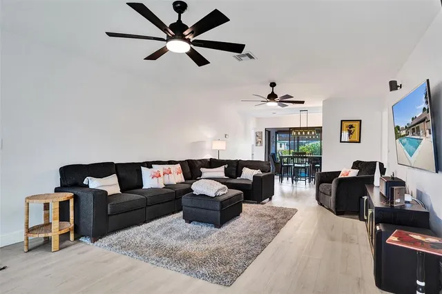 a living room with furniture and a large window