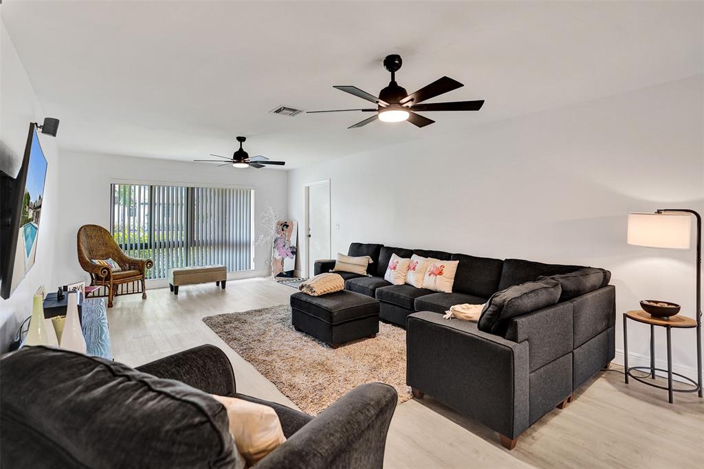 4840 Greentree Lane, Unit B Boynton Beach, FL 33436 - Photo 10 of 68 a living room with furniture and a large window