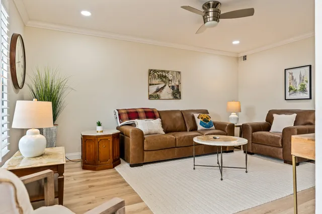 a living room with furniture and a lamp