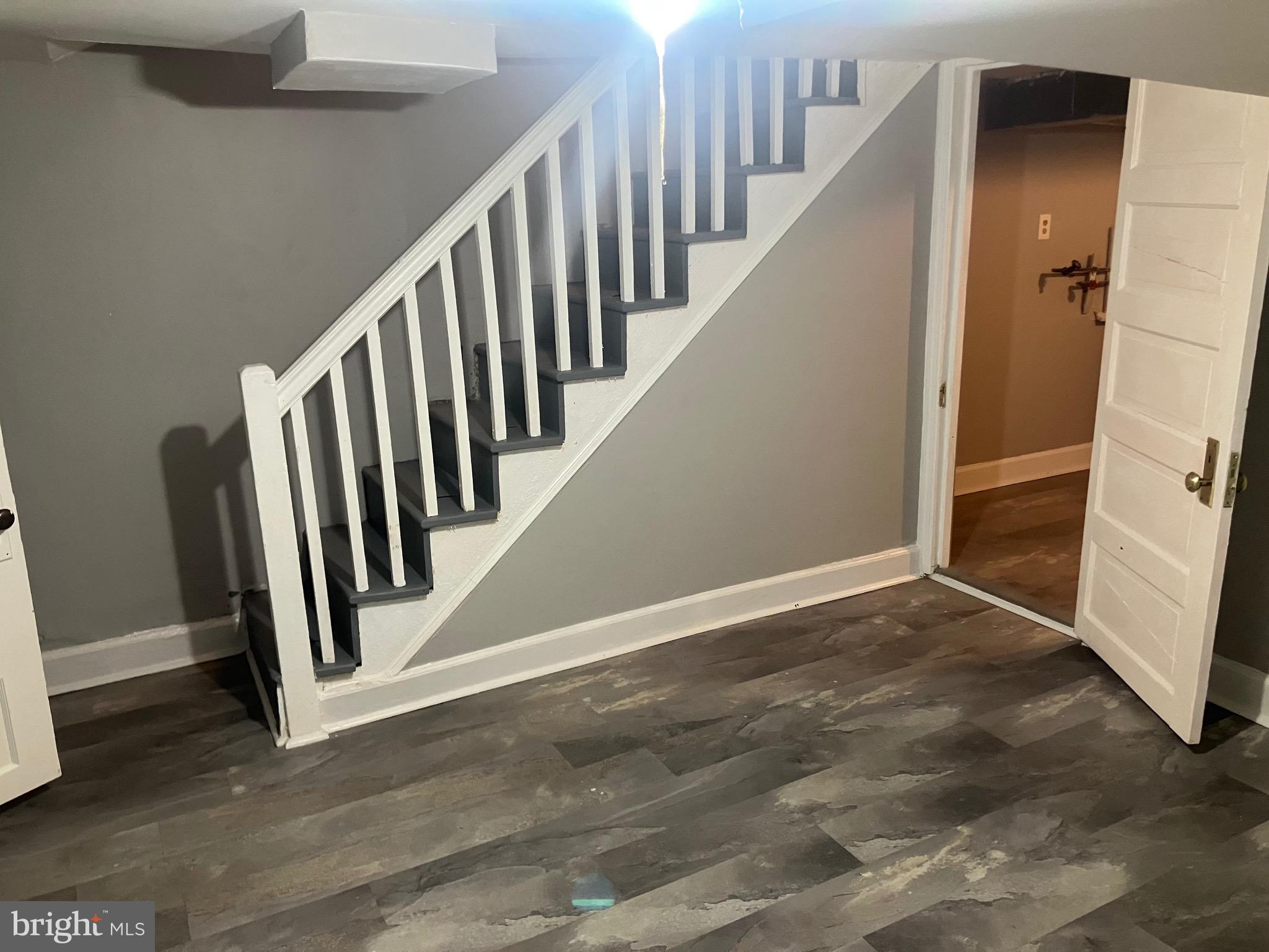 2540 Aisquith Street Baltimore, MD 21218 - Photo 14 of 15 a view of a hallway with staircase