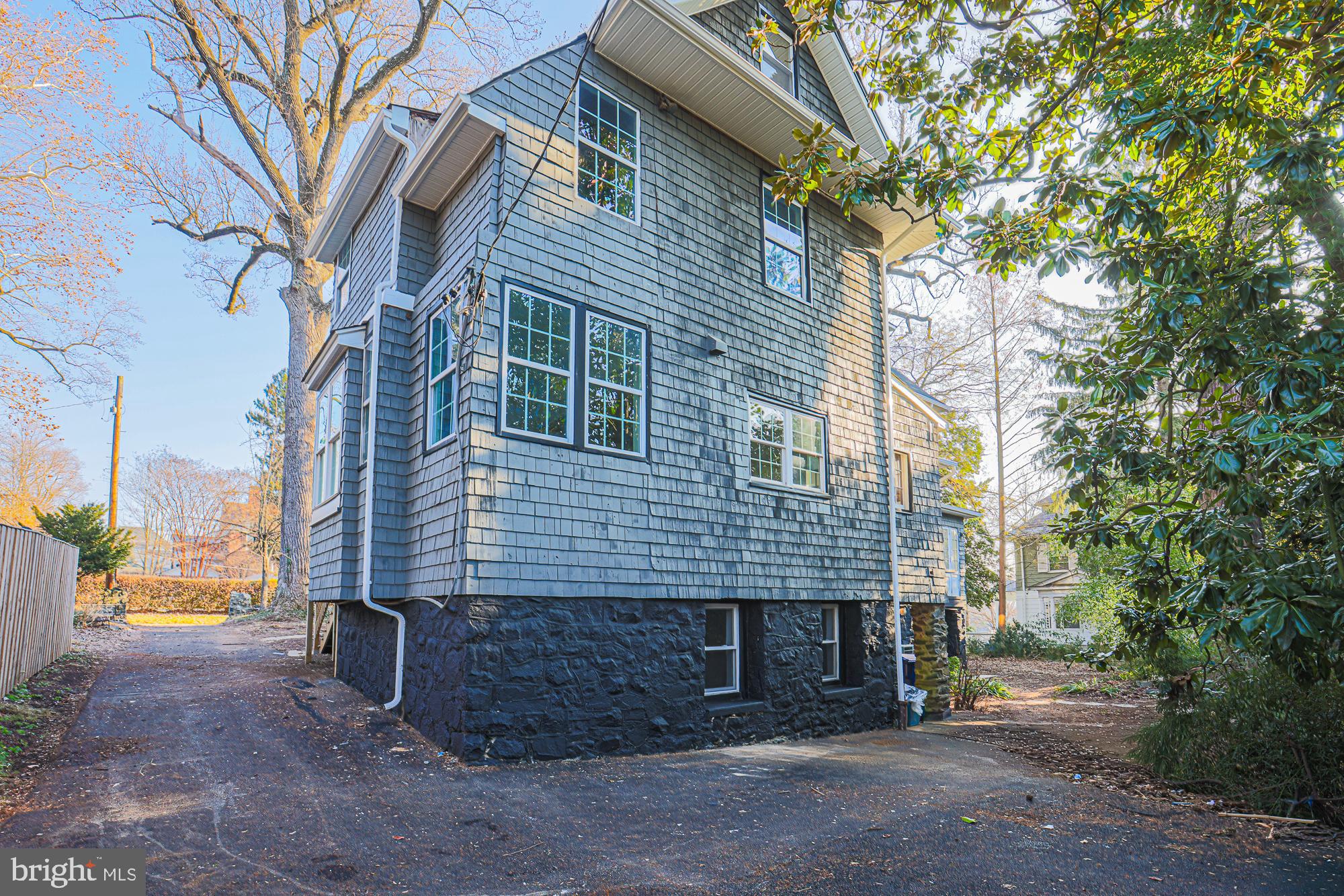Charming multi-story home with unique siding.