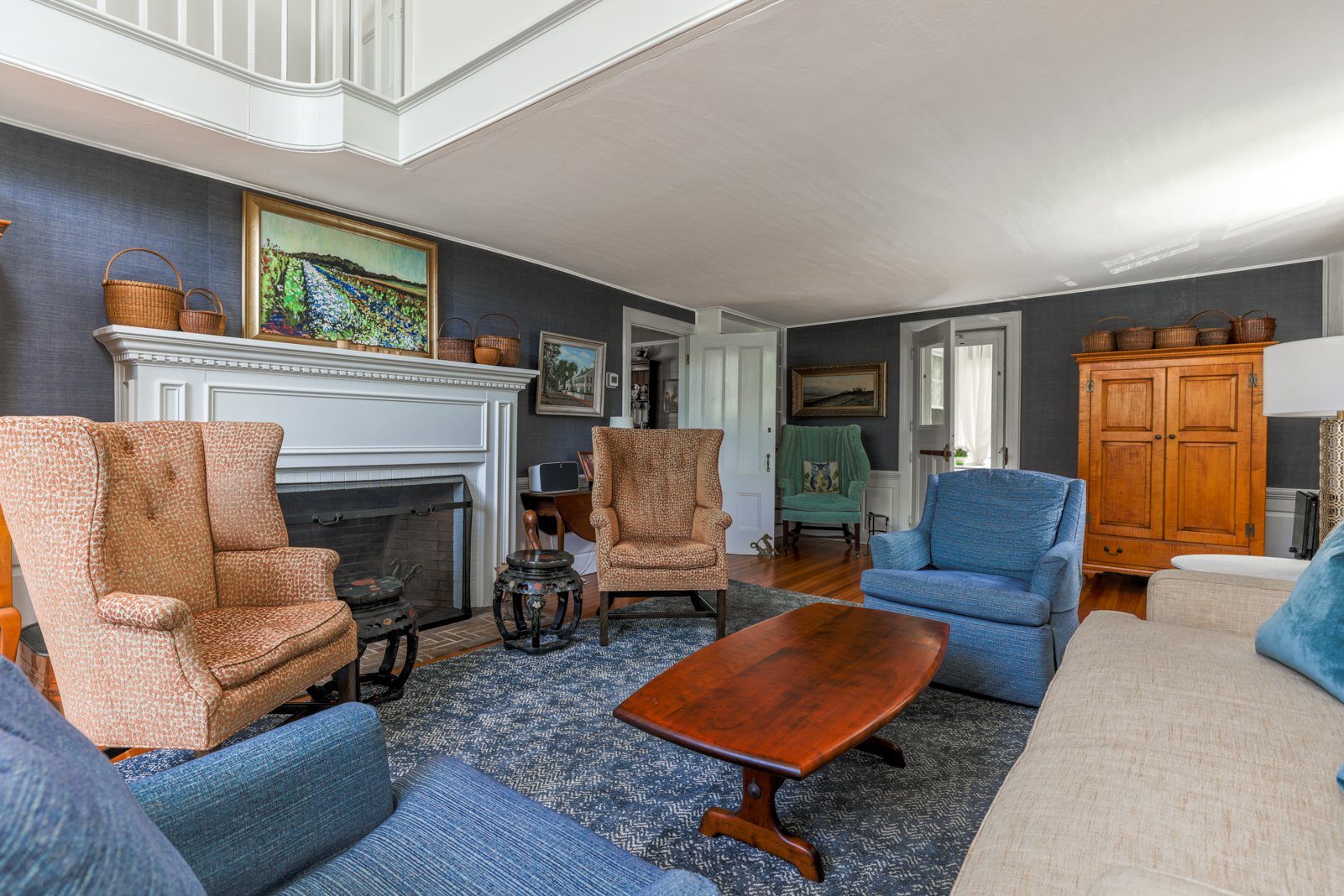 12 Hussey Street Nantucket, MA 02554 - Photo 13 of 47 a living room with furniture and a fireplace