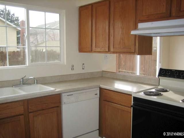 2390 East 9th Street Reno, NV 89512 - Photo 4 of 7 a kitchen with a sink cabinets and window
