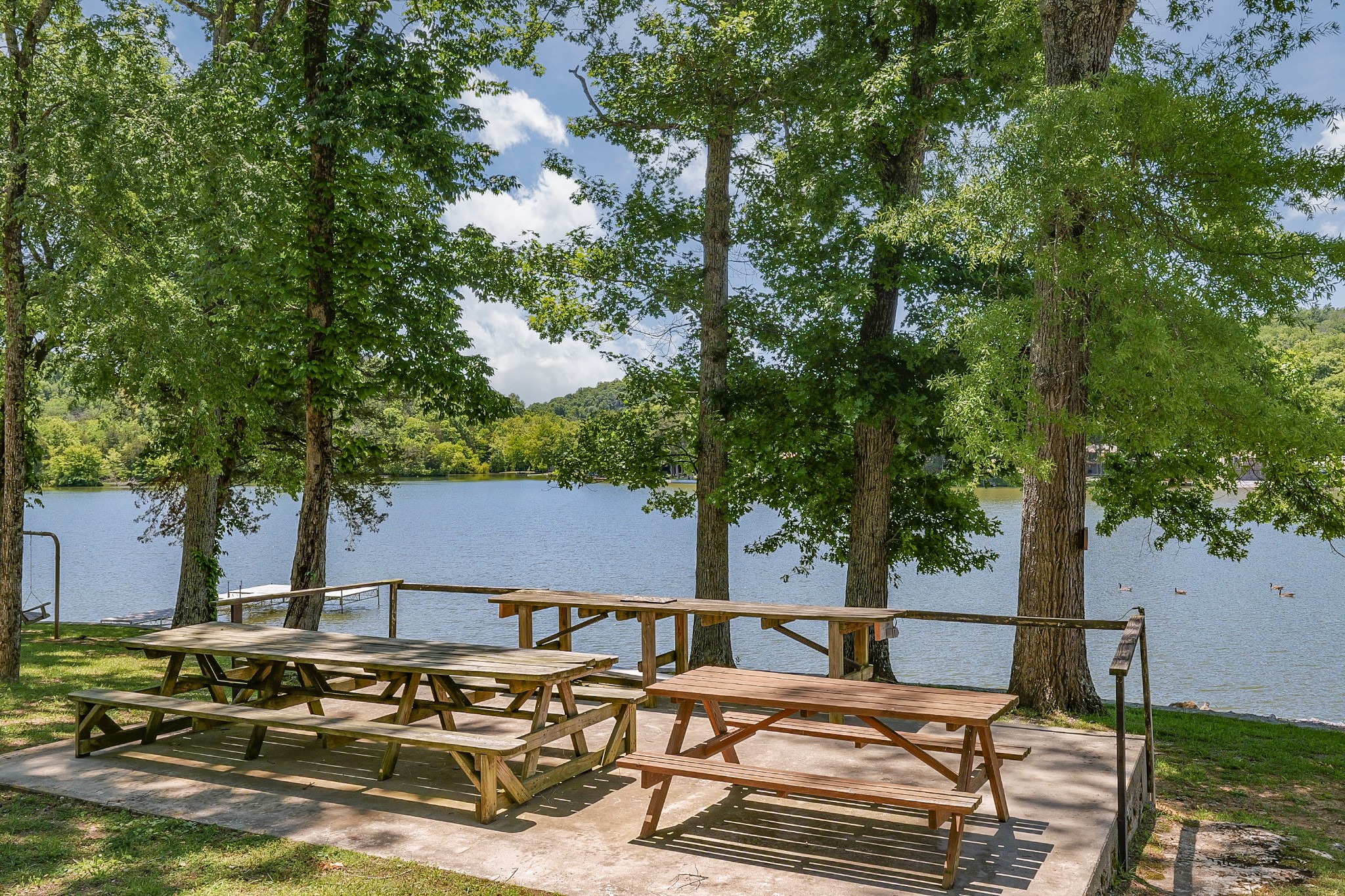 21 Lincoln Lake Road Kelso, TN 37348 - Photo 23 of 26 a view of a patio with table and chairs with wooden fence and plants
