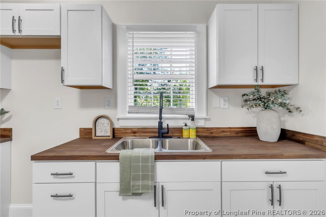 203 Trinity Street Fairmont, NC 28340 - Photo 13 of 34 a kitchen with a sink and a window