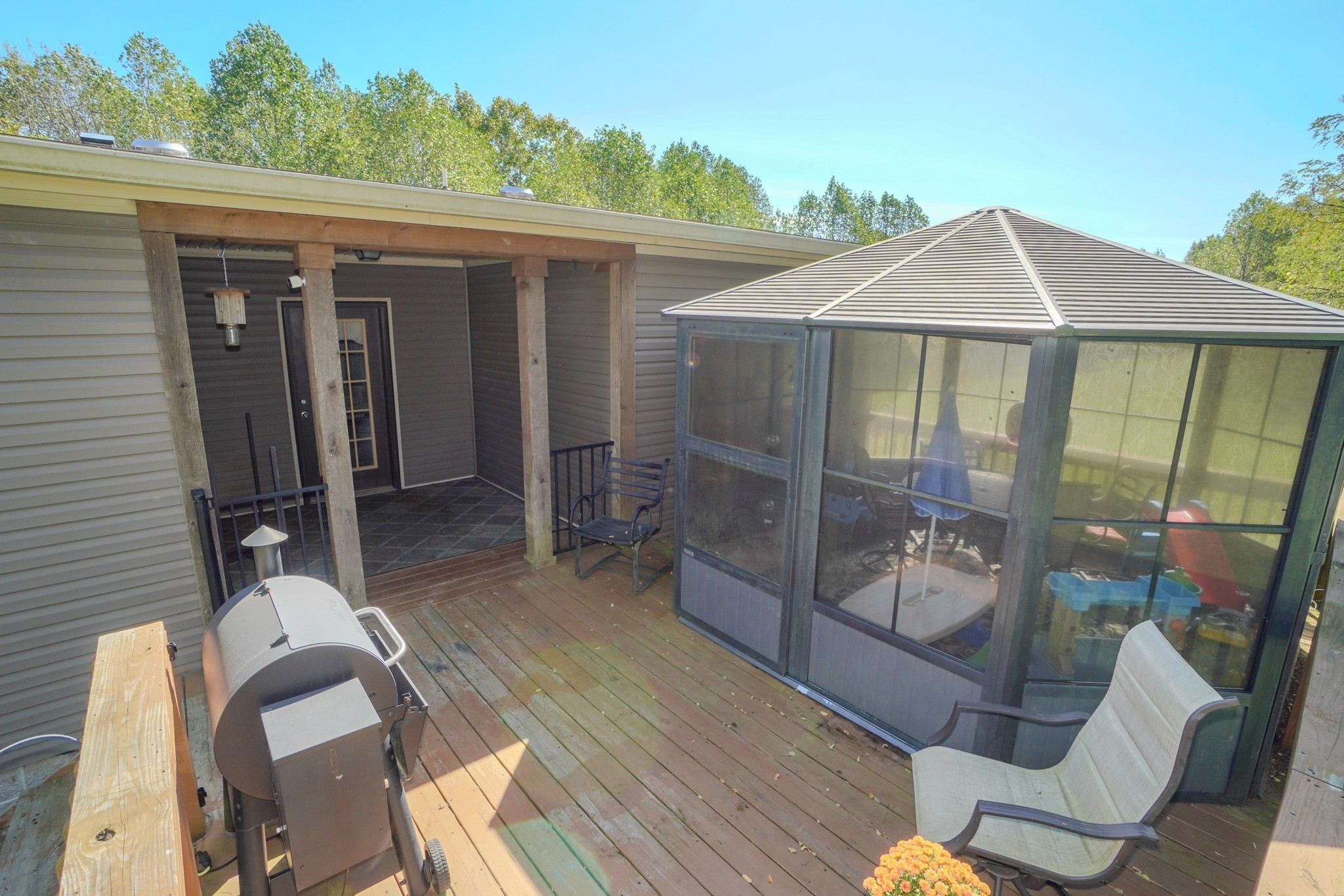 137 Hawkins Road Westmoreland, TN 37186 - Photo 19 of 71 a view of a patio with table and chairs near a barbeque
