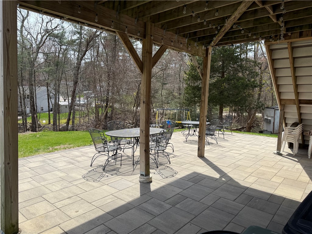 31 Clarke Road Coventry, RI 02816 - Photo 26 of 26 Stamped concrete patio overlooking back yard