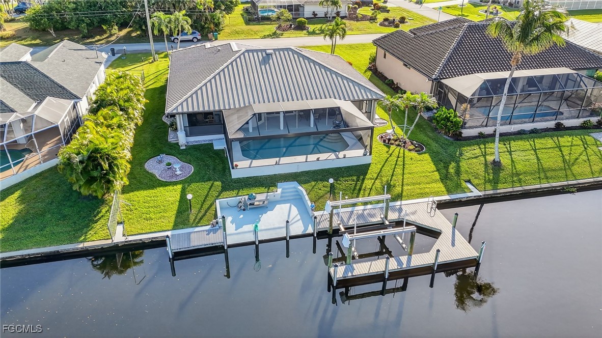 4306 Southwest 3rd Avenue Cape Coral, FL 33914 - Photo 43 of 50 an aerial view of a chairs and table in the balcony