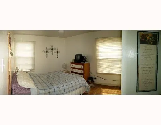 a en suite bathroom with a sink and a large mirror