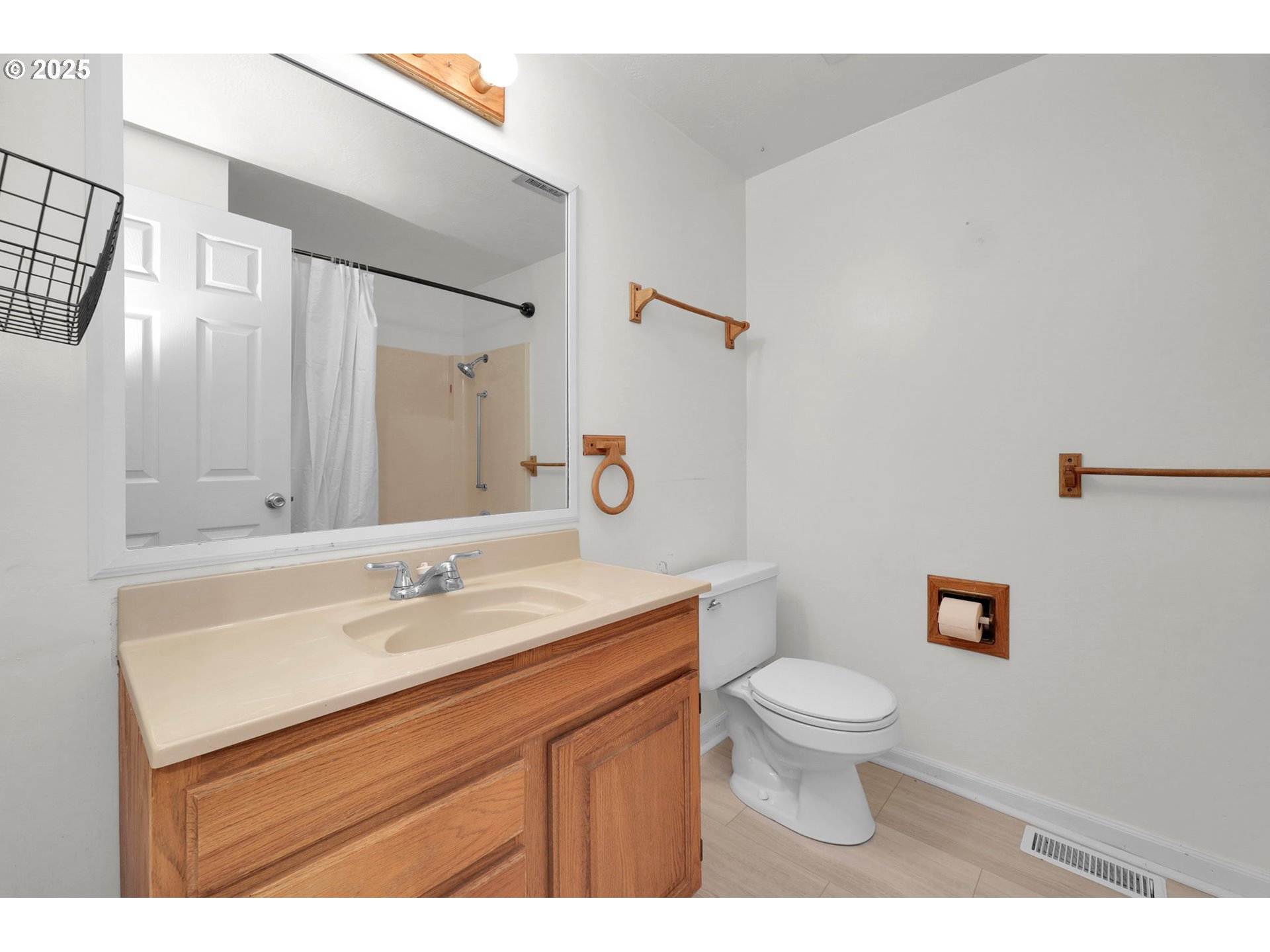 2793 Summer Lane Eugene, OR 97404 - Photo 9 of 15 a bathroom with a sink a toilet a mirror and shower