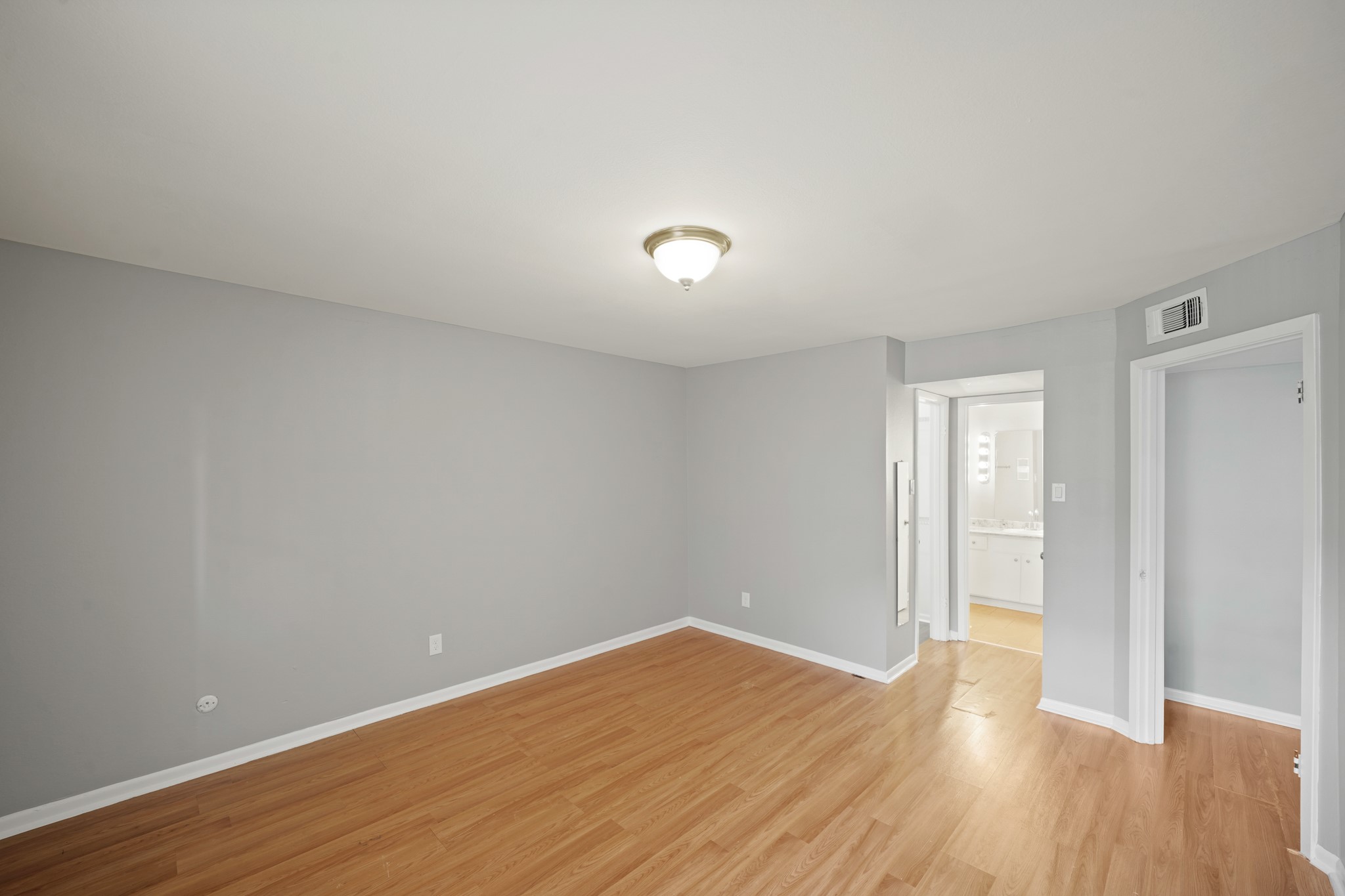 8517 Hearth Drive, Unit 5 Houston, TX 77054 - Photo 12 of 20 a view of an empty room with wooden floor