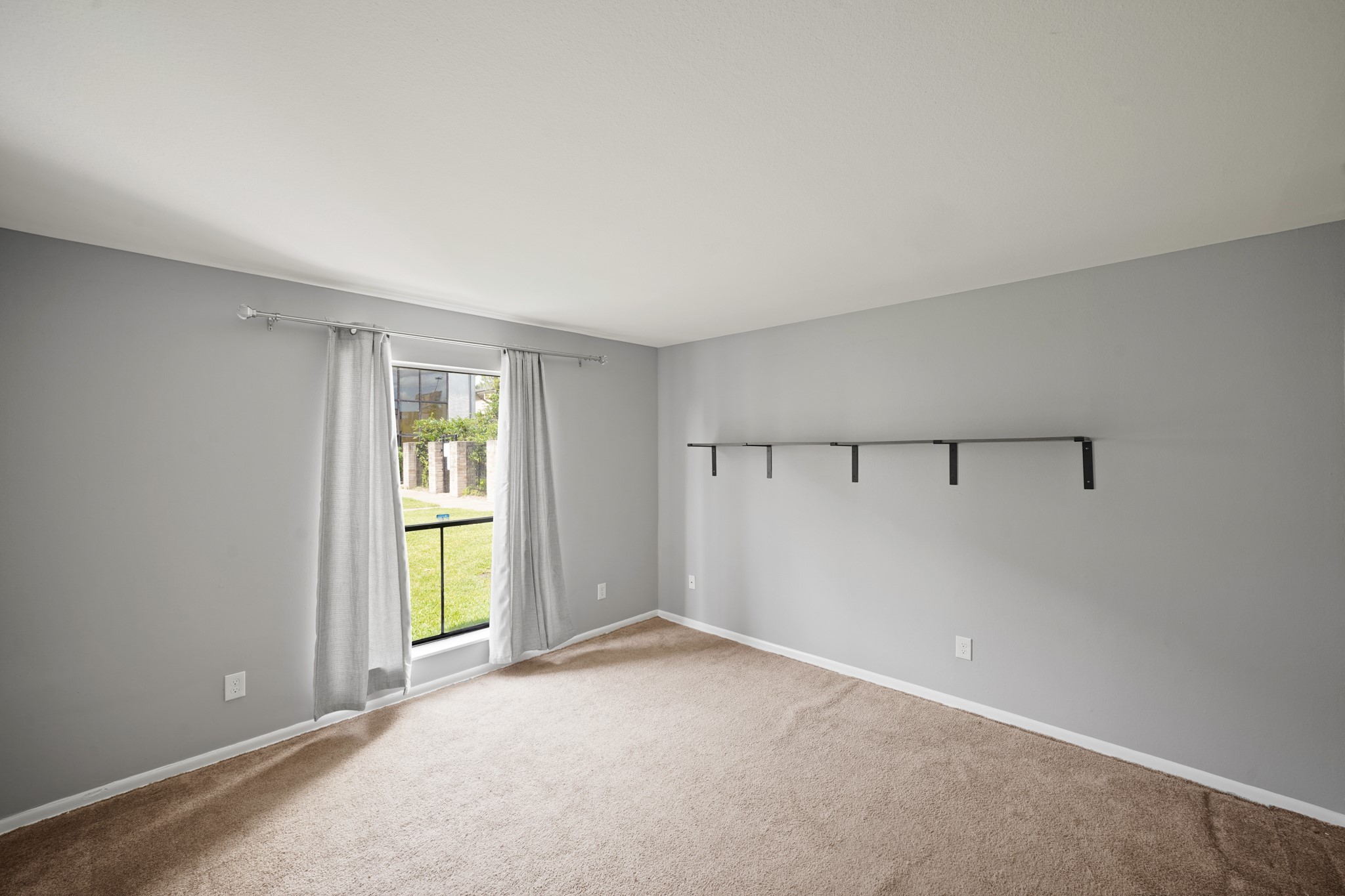 8517 Hearth Drive, Unit 5 Houston, TX 77054 - Photo 14 of 20 a view of an empty room with a window