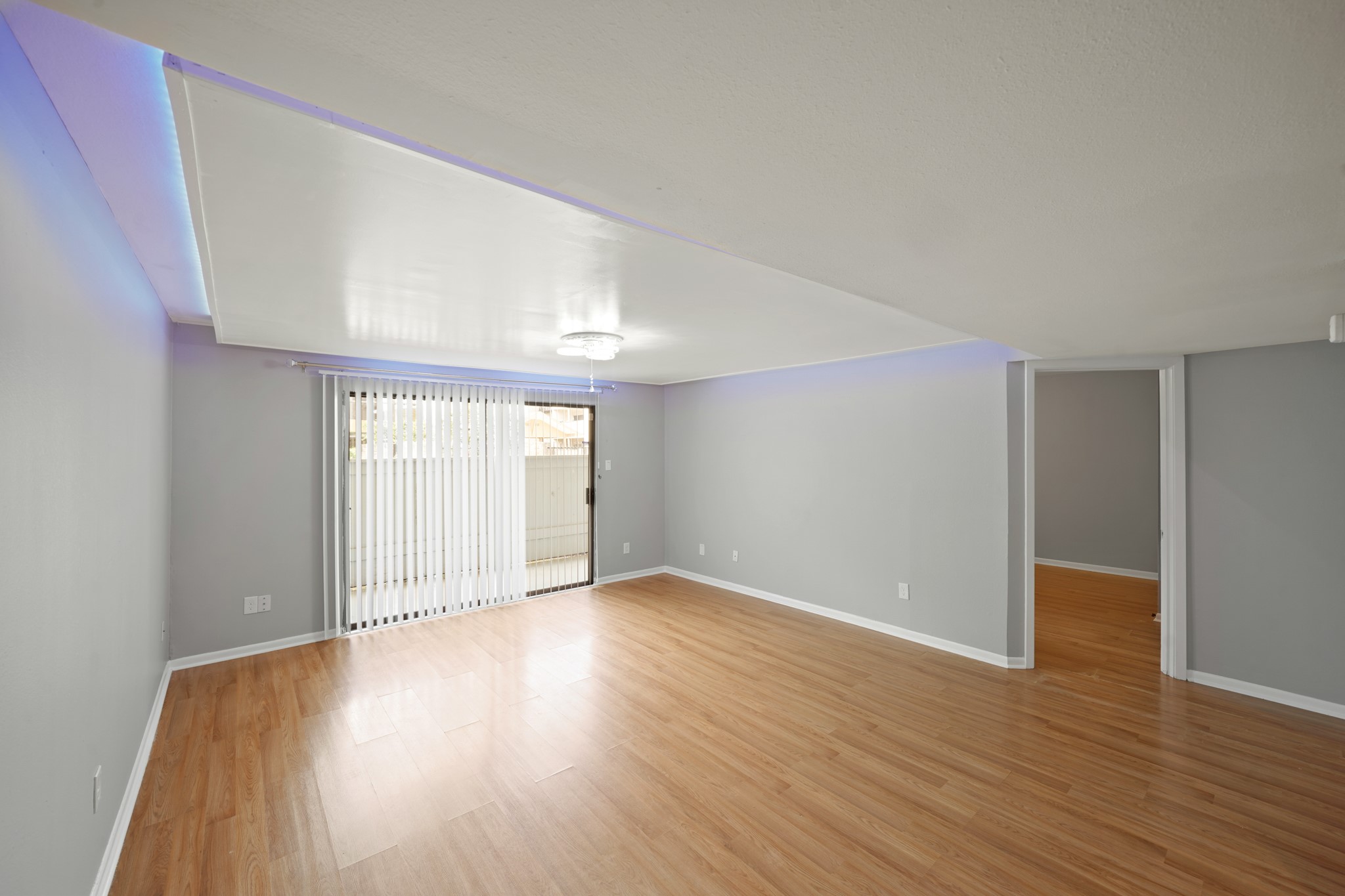 8517 Hearth Drive, Unit 5 Houston, TX 77054 - Photo 2 of 20 an empty room with wooden floor and windows