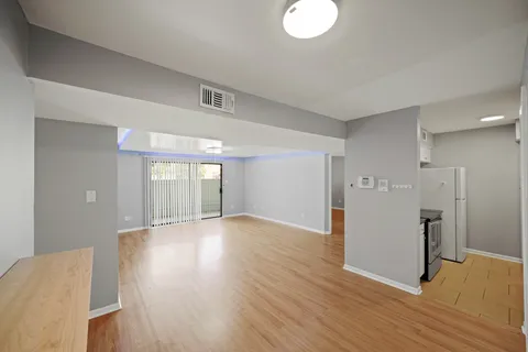 a view of a livingroom with wooden floor
