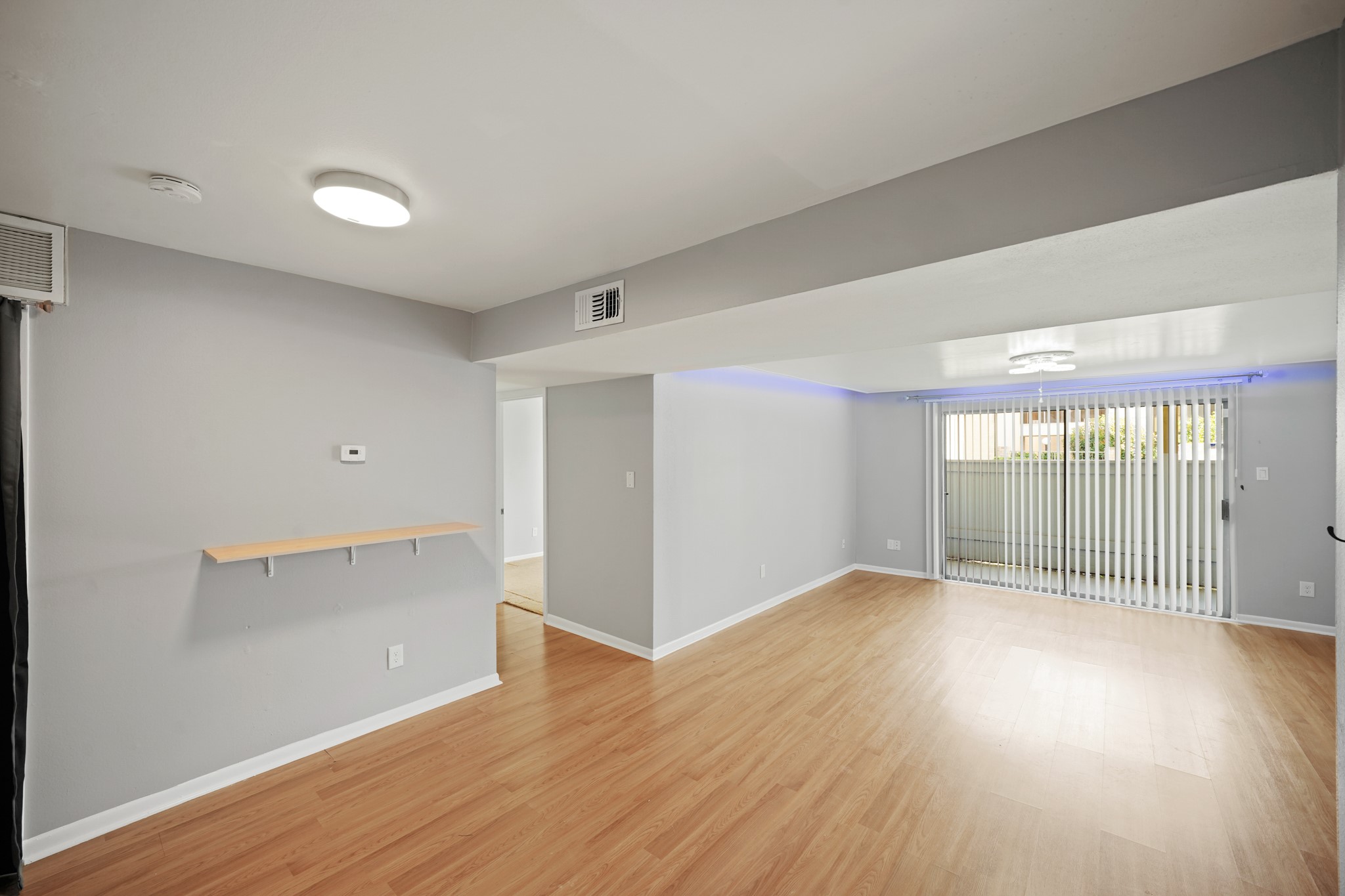 8517 Hearth Drive, Unit 5 Houston, TX 77054 - Photo 6 of 20 wooden floor in an empty room with a window