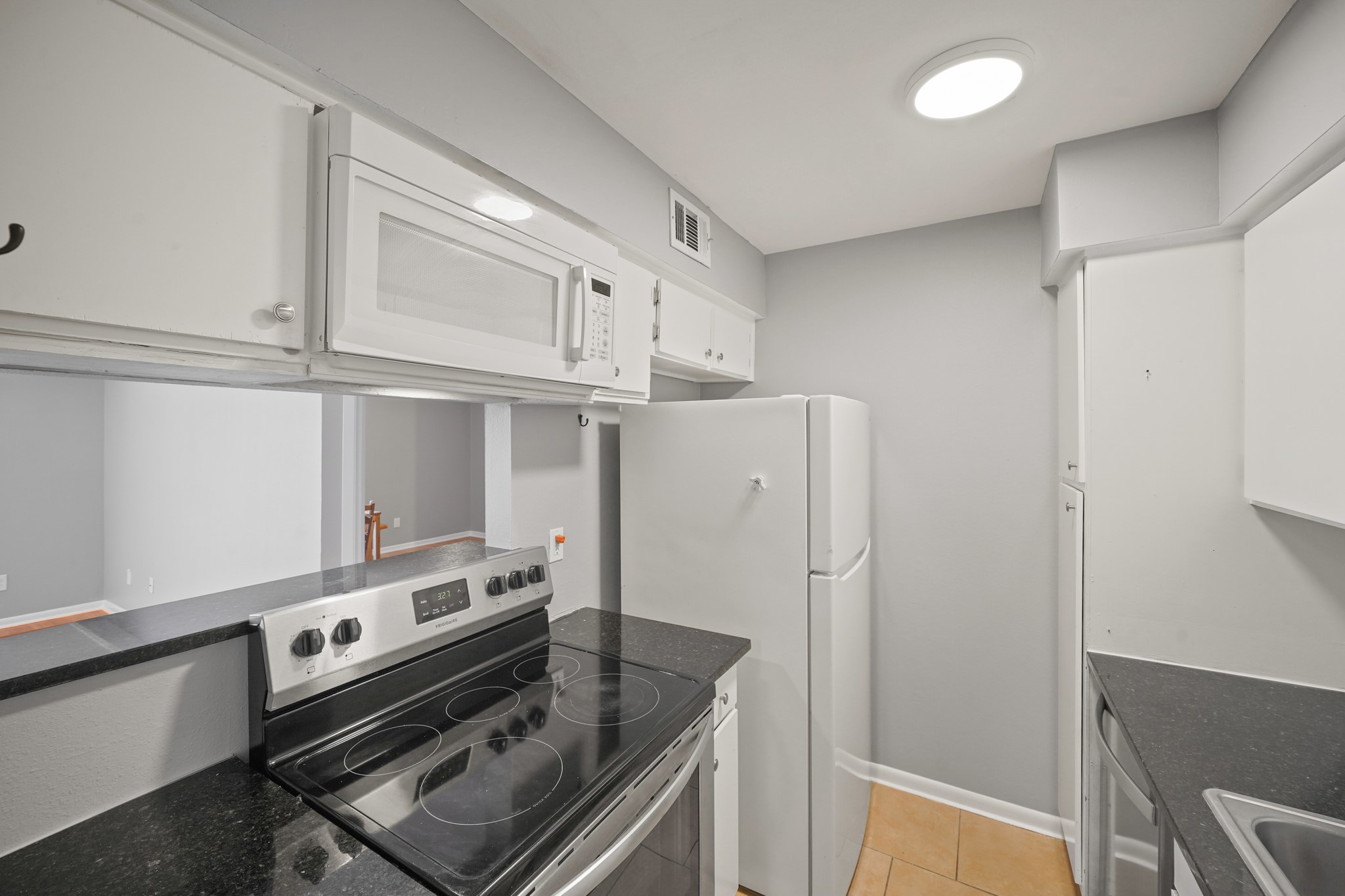8517 Hearth Drive, Unit 5 Houston, TX 77054 - Photo 7 of 20 a kitchen with stainless steel appliances a refrigerator and a stove