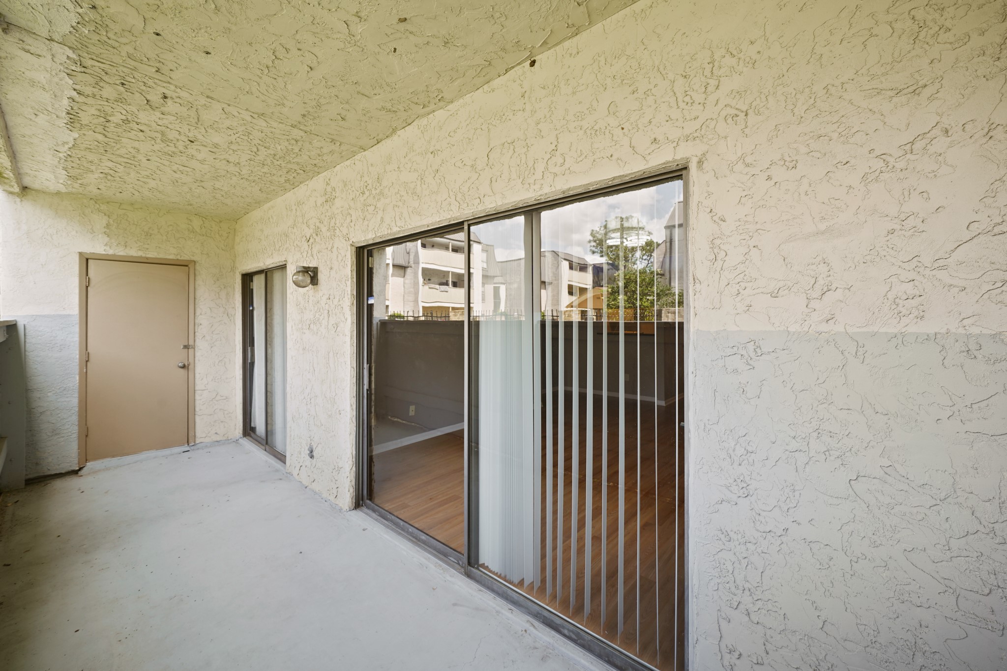 8517 Hearth Drive, Unit 5 Houston, TX 77054 - Photo 9 of 20 a view of a hallway with wooden floor and staircase