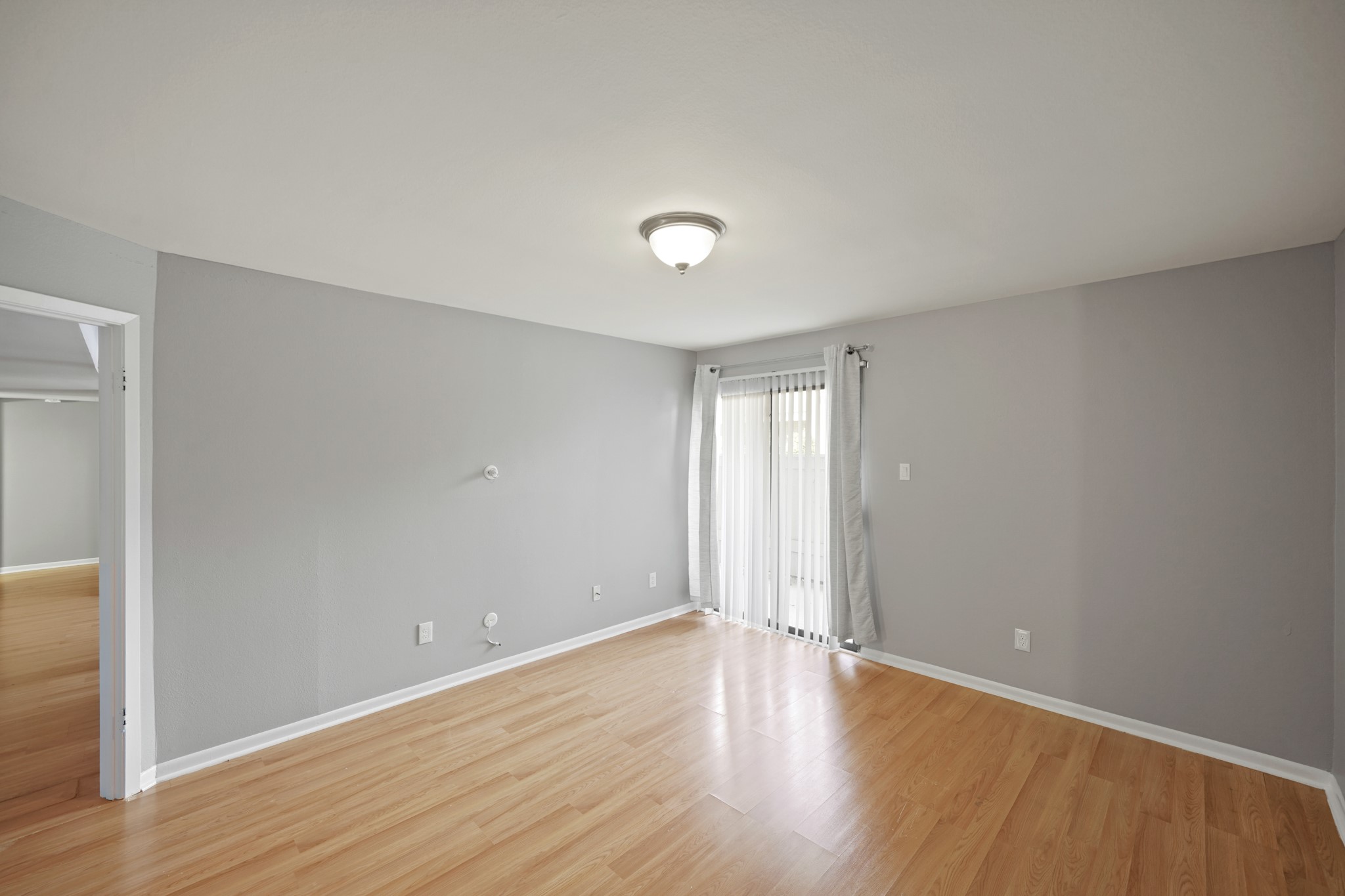 8517 Hearth Drive, Unit 5 Houston, TX 77054 - Photo 10 of 20 a view of an empty room with wooden floor
