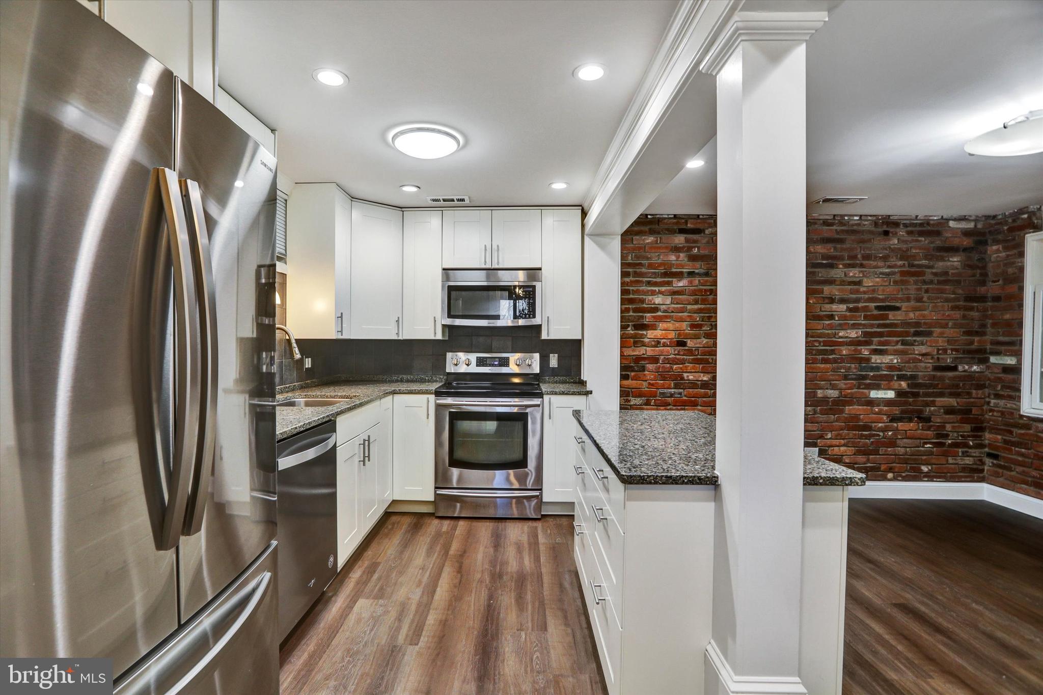 722 Genessee Street Annapolis, MD 21401 - Photo 12 of 42 a kitchen with stainless steel appliances a refrigerator sink and stove