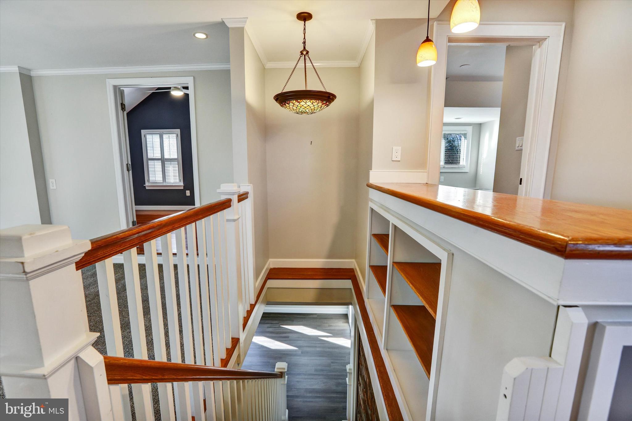 722 Genessee Street Annapolis, MD 21401 - Photo 19 of 42 a view of a hallway with wooden floor and staircase