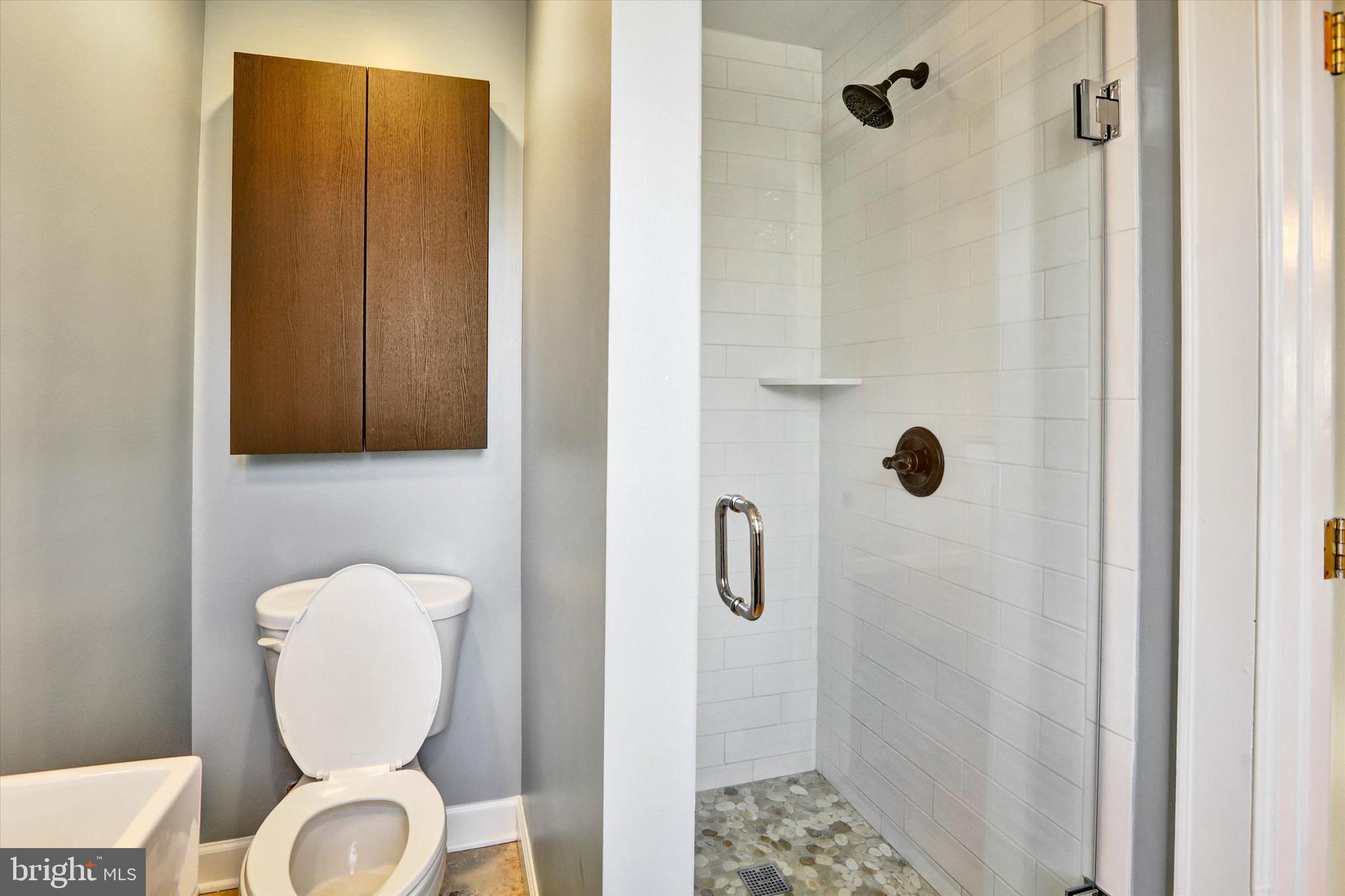722 Genessee Street Annapolis, MD 21401 - Photo 21 of 42 a bathroom with a toilet and a mirror