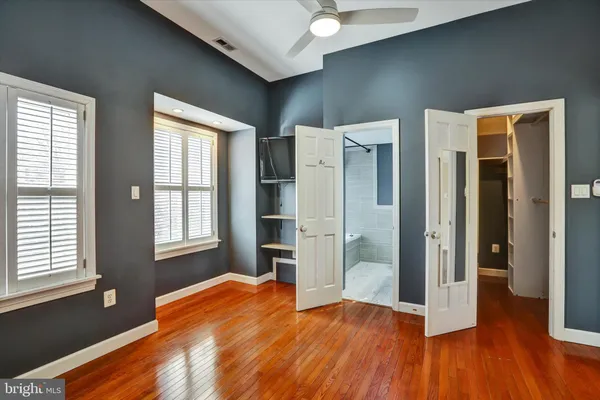 a view of a kitchen with a sink and a refrigerator