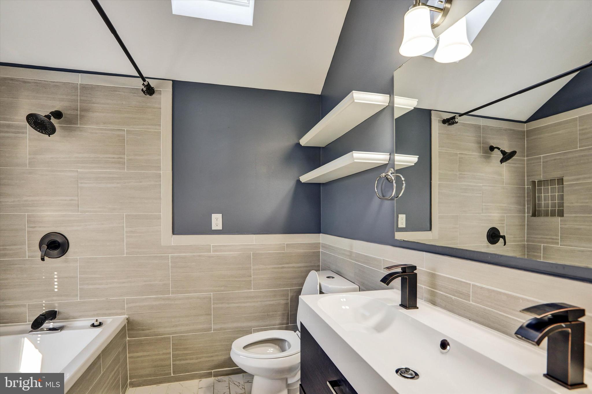 722 Genessee Street Annapolis, MD 21401 - Photo 26 of 42 a bathroom with a sink a toilet and shower