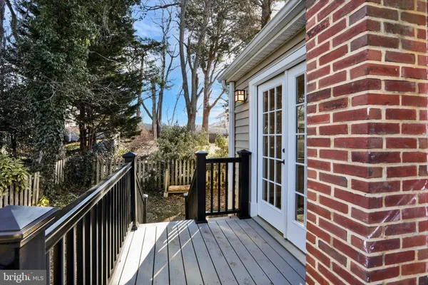 a view of a house with backyard water fountain and a patio