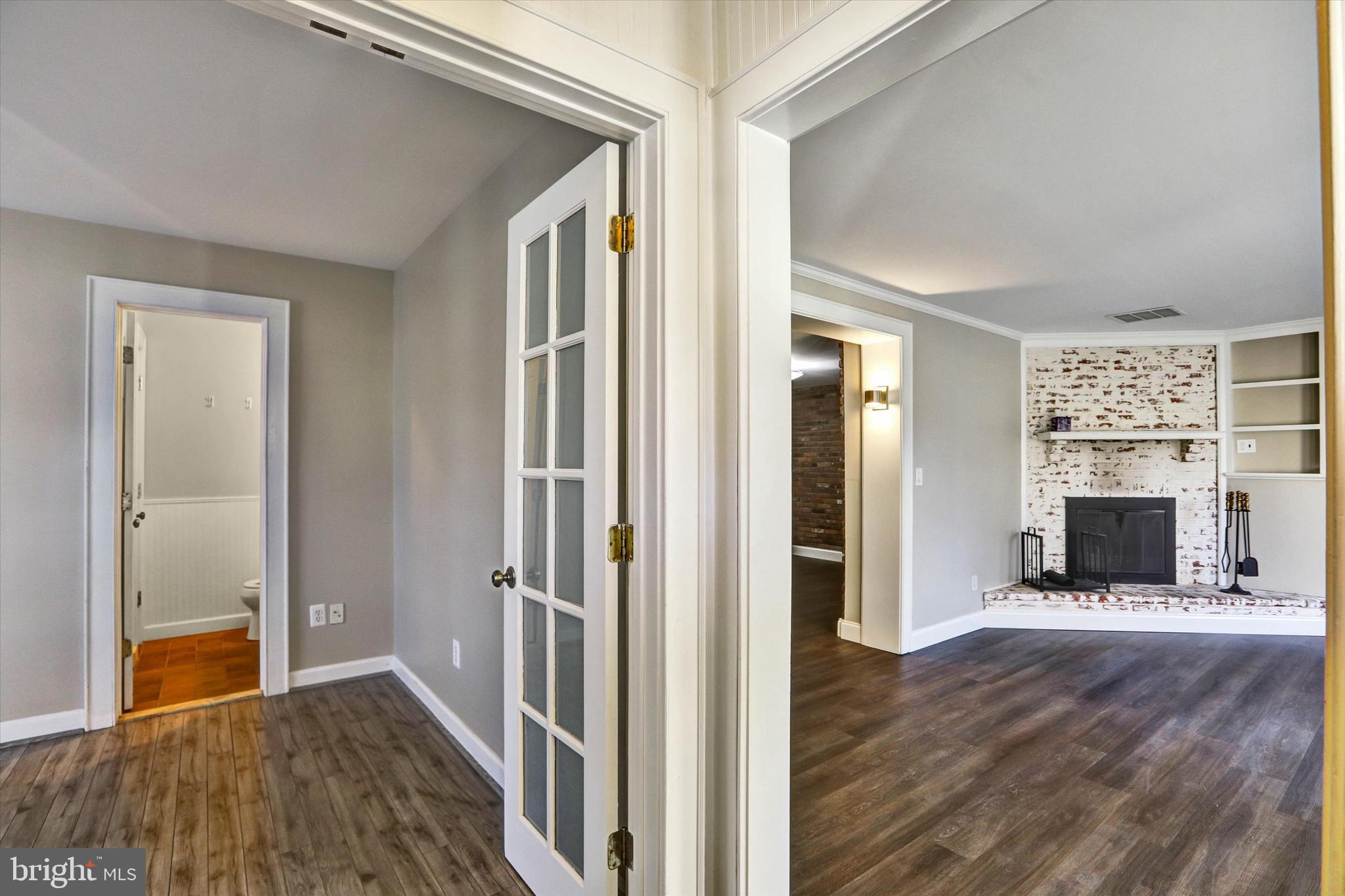722 Genessee Street Annapolis, MD 21401 - Photo 6 of 42 a view of an empty room with wooden floor and a window