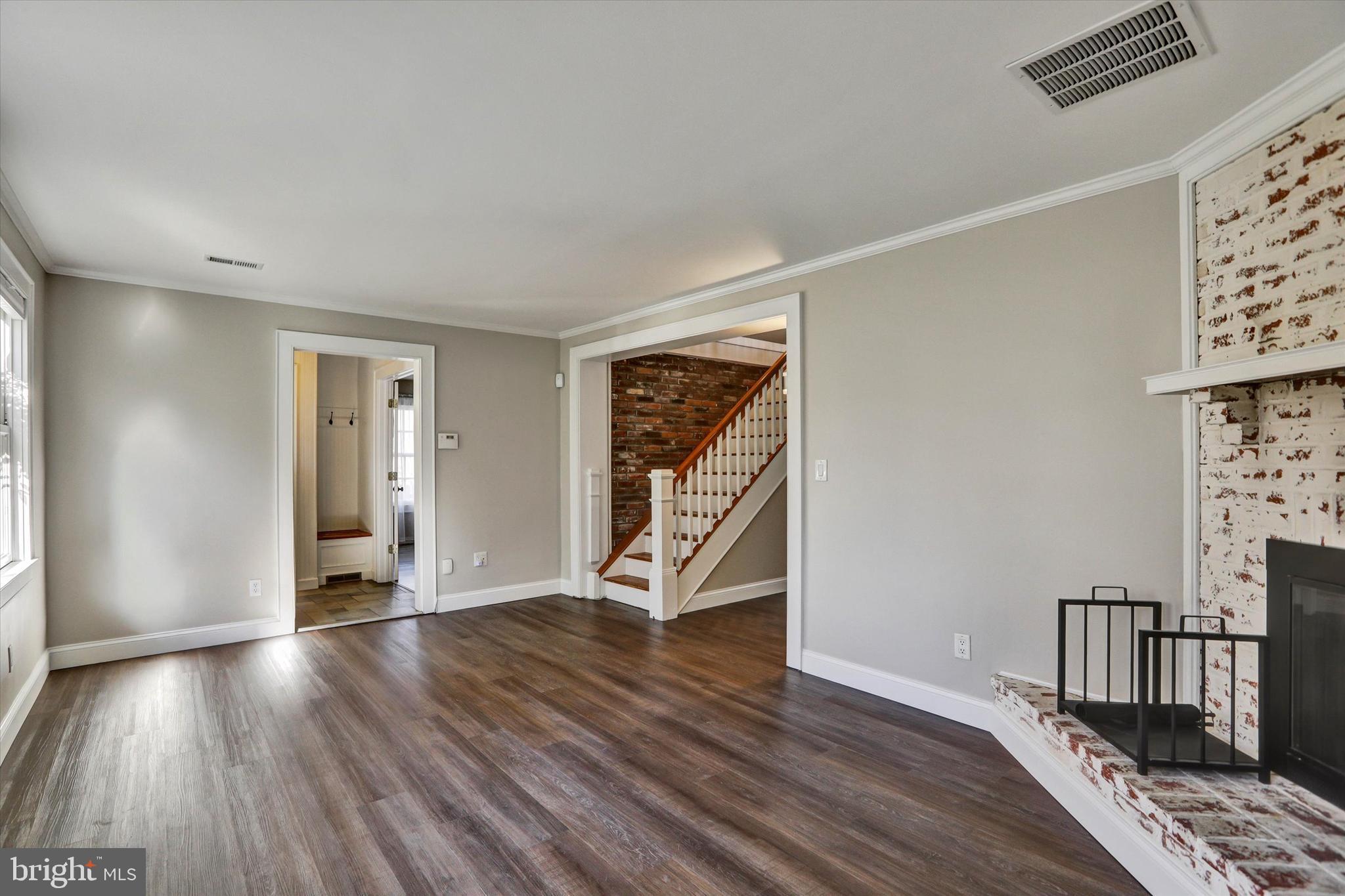 722 Genessee Street Annapolis, MD 21401 - Photo 9 of 42 a view of an empty room with wooden floor and a window