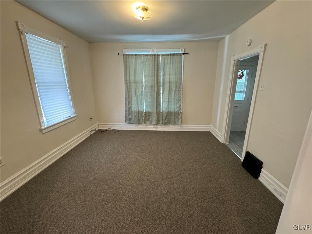 128 Center Street Slatington, PA 18080 - Photo 2 of 9 an empty room with windows