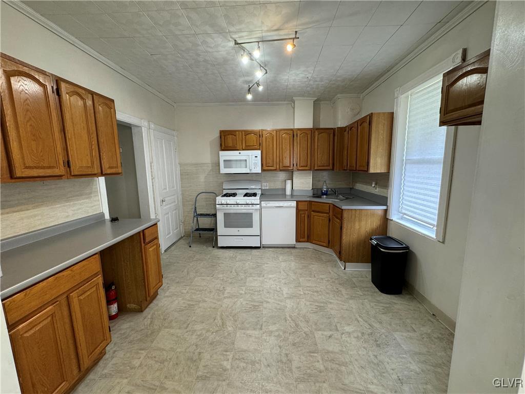 128 Center Street Slatington, PA 18080 - Photo 4 of 9 a kitchen with stainless steel appliances a stove sink and cabinets