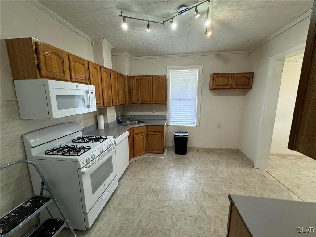 128 Center Street Slatington, PA 18080 - Photo 5 of 9 a kitchen with stainless steel appliances granite countertop a stove a sink and a microwave