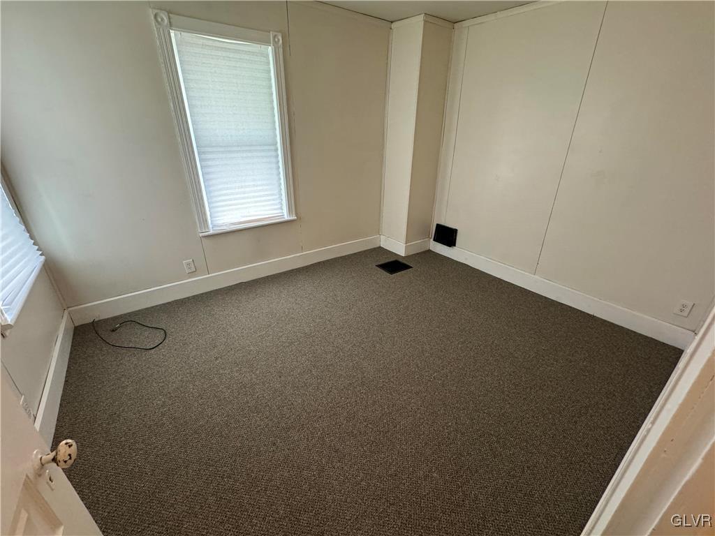 128 Center Street Slatington, PA 18080 - Photo 8 of 9 an empty room with windows