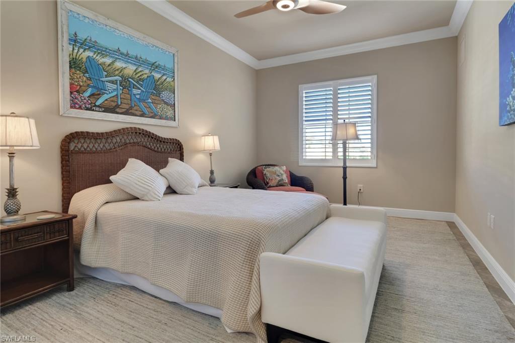 21450 Strada Nuova Circle, Unit A301 Estero, FL 33928 - Photo 18 of 40 a bedroom with bed and window