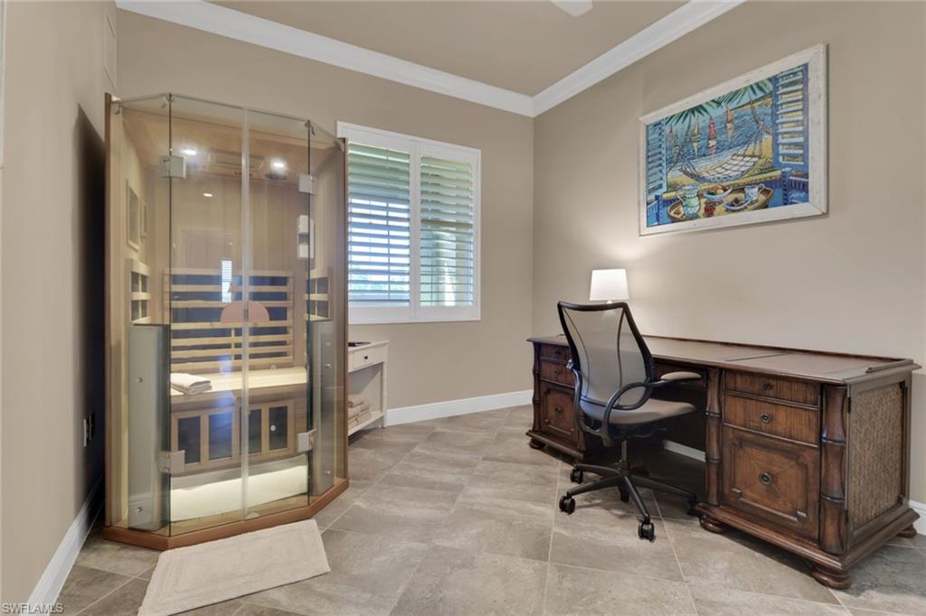 21450 Strada Nuova Circle, Unit A301 Estero, FL 33928 - Photo 23 of 40 a view of a workspace with furniture and a window