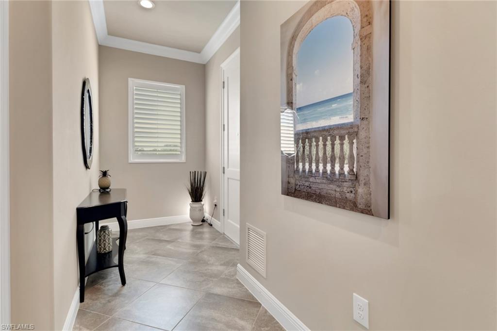 21450 Strada Nuova Circle, Unit A301 Estero, FL 33928 - Photo 24 of 40 a view of a room that has a bed and a window in it